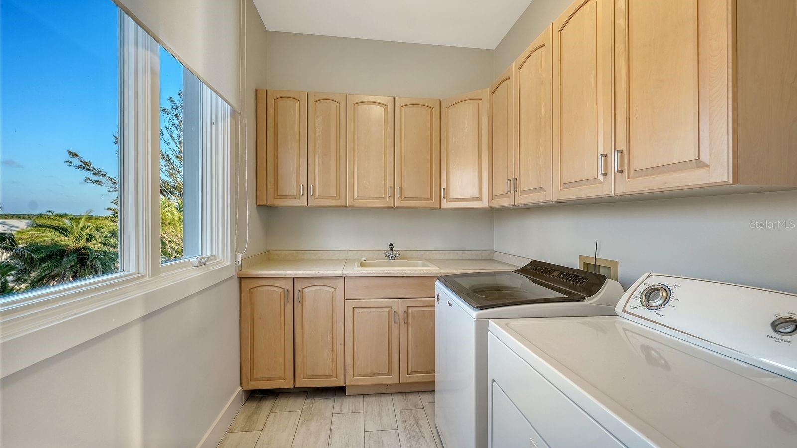 Laundry room on same level as 3 bedrooms