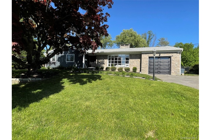 Front of home with new garage door