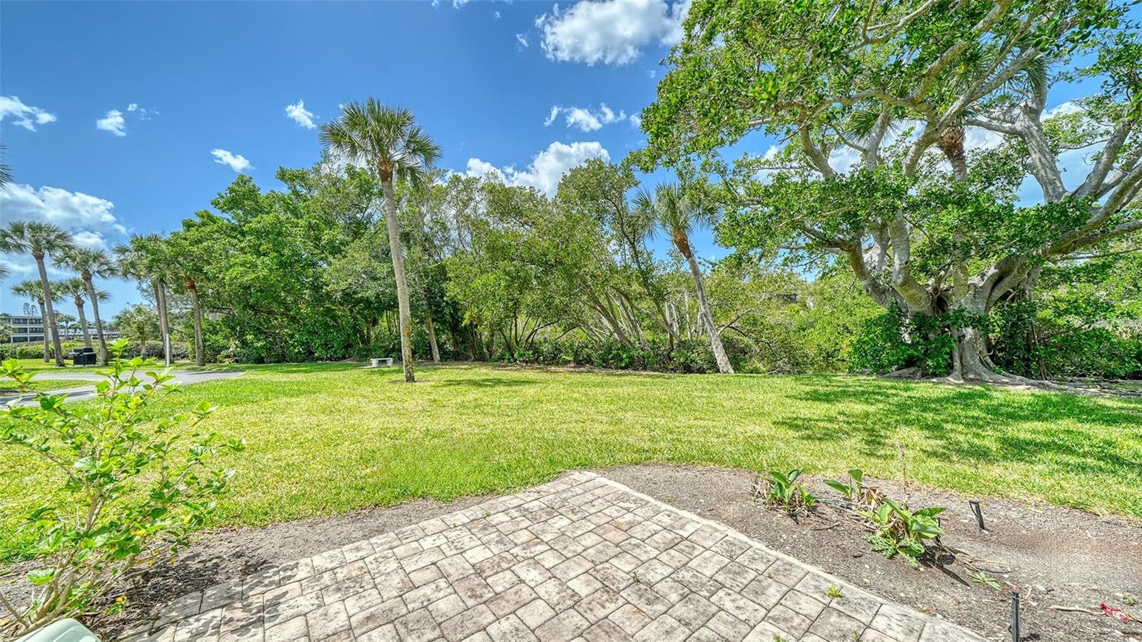 The small brick patio off the lanai is great for grilling or relaxing after a day at the beach.