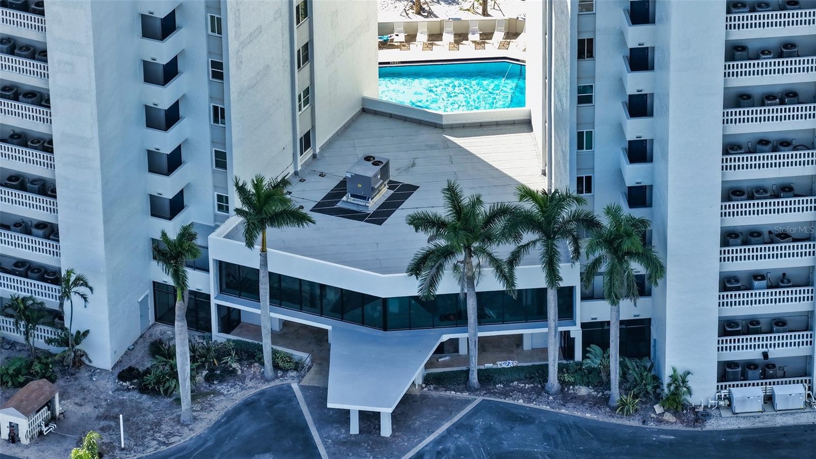 Beachside pool - the 2nd of 2 heated pools on the property.  Newly fenced and travertine tiled.