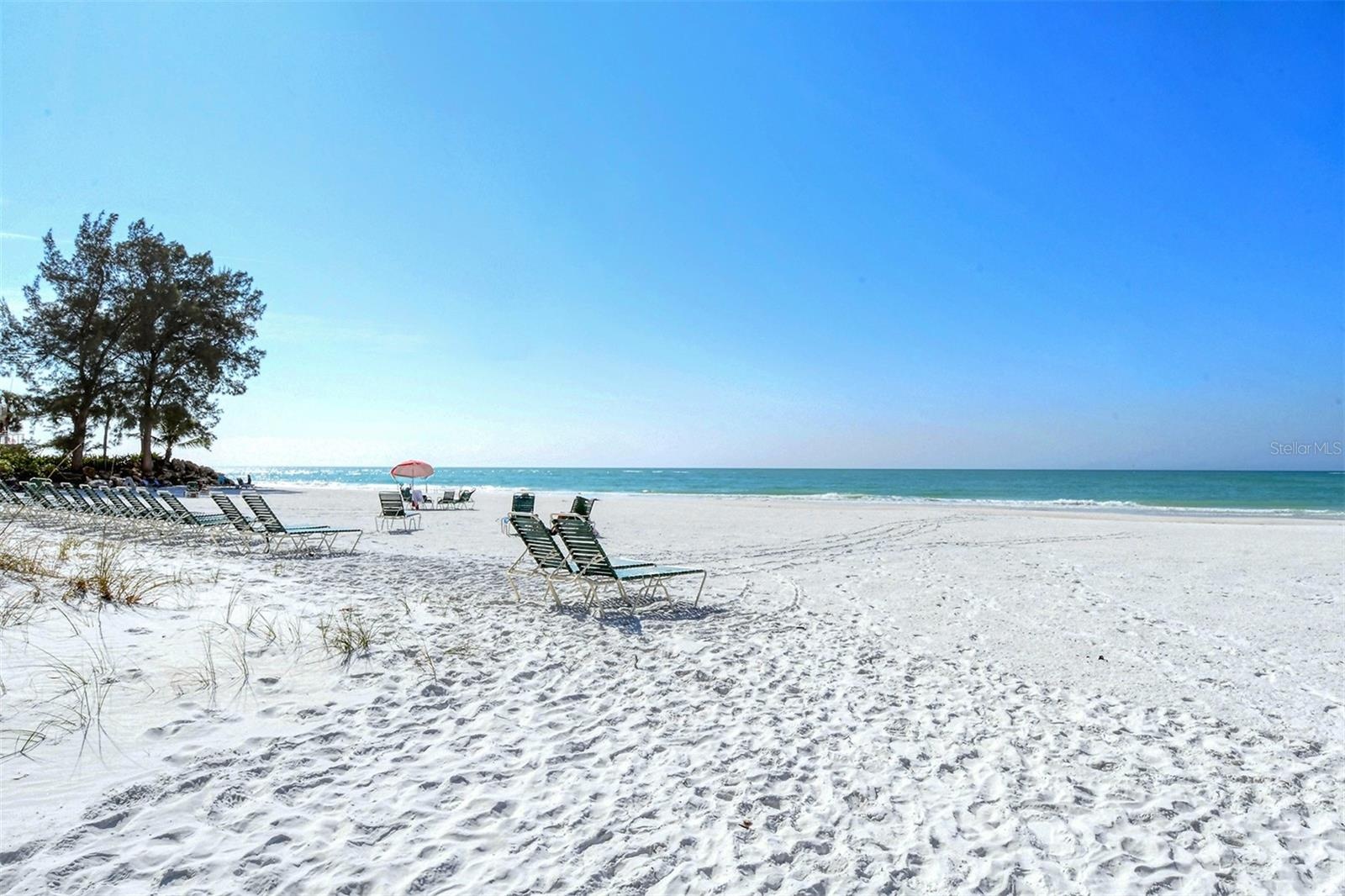 The cool quartz sands of the Whispering Sands private beach.