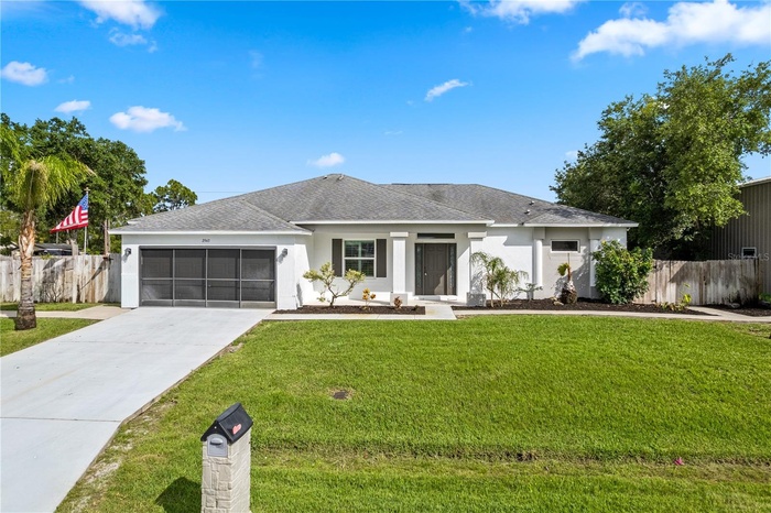Stunning front elevation with beautiful curb appeal and manicured landscaping