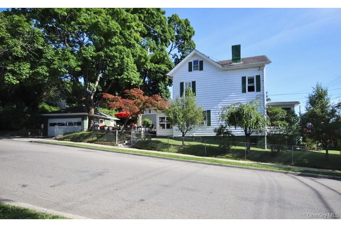 Maintained vintage Colonial, ideally situated on a desirable corner lot in the heart of the village!