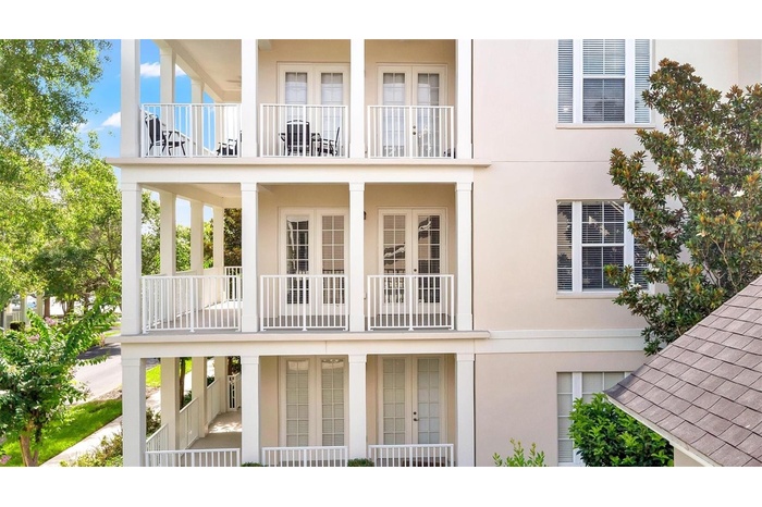 Home located on second floor with elegant wrap-around porch