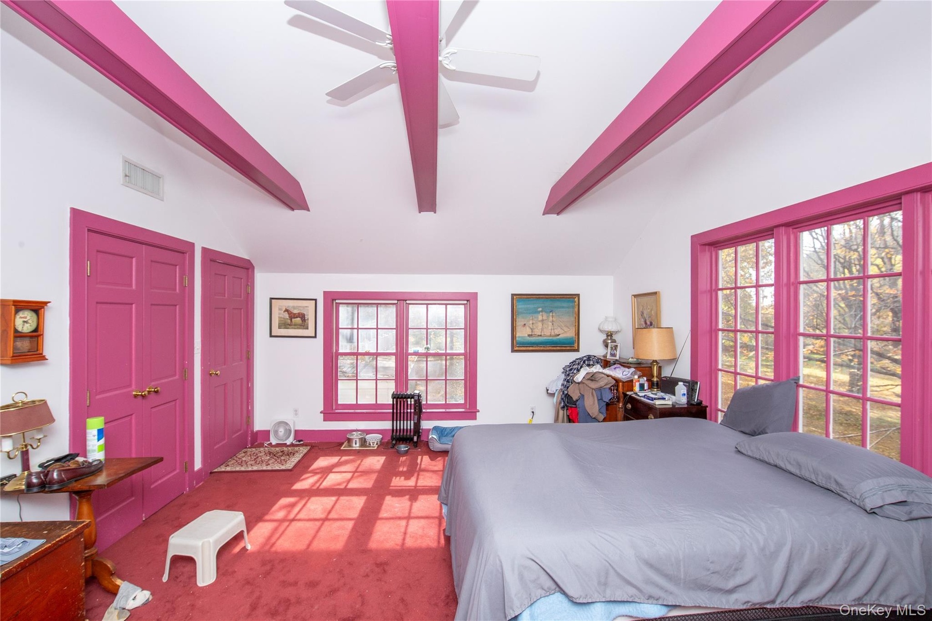 Bedroom 1 With Beamed Ceiling, Carpet with hardwoods under