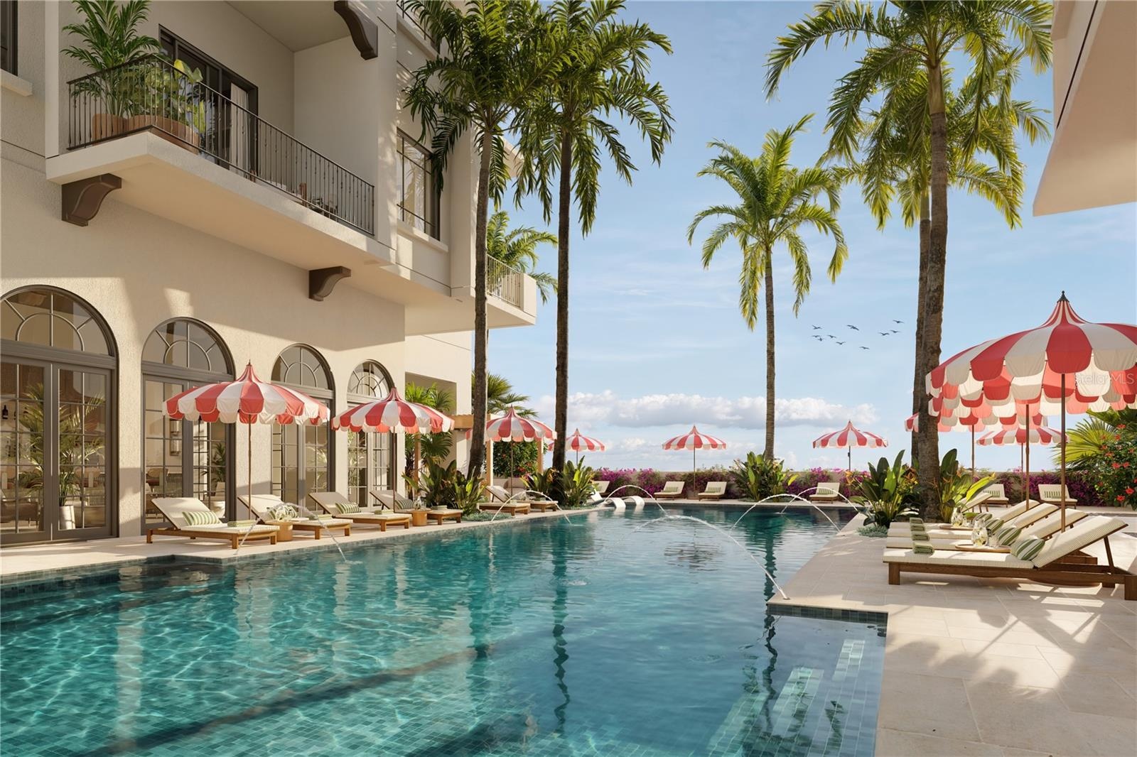 The 70-foot-resort-style pool at Mira Mar is complemented by a lounging area with a spacious sun deck, hot tub, and dedicated towel service, creating 