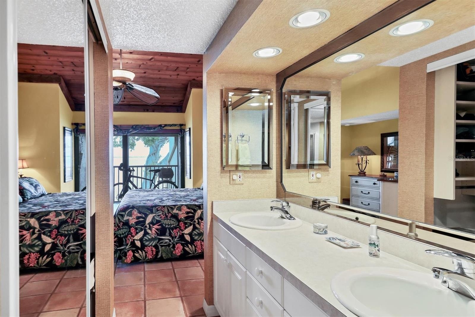 Primary Bath with Mirror Fronted Walk-In Closet & Dual Sinks