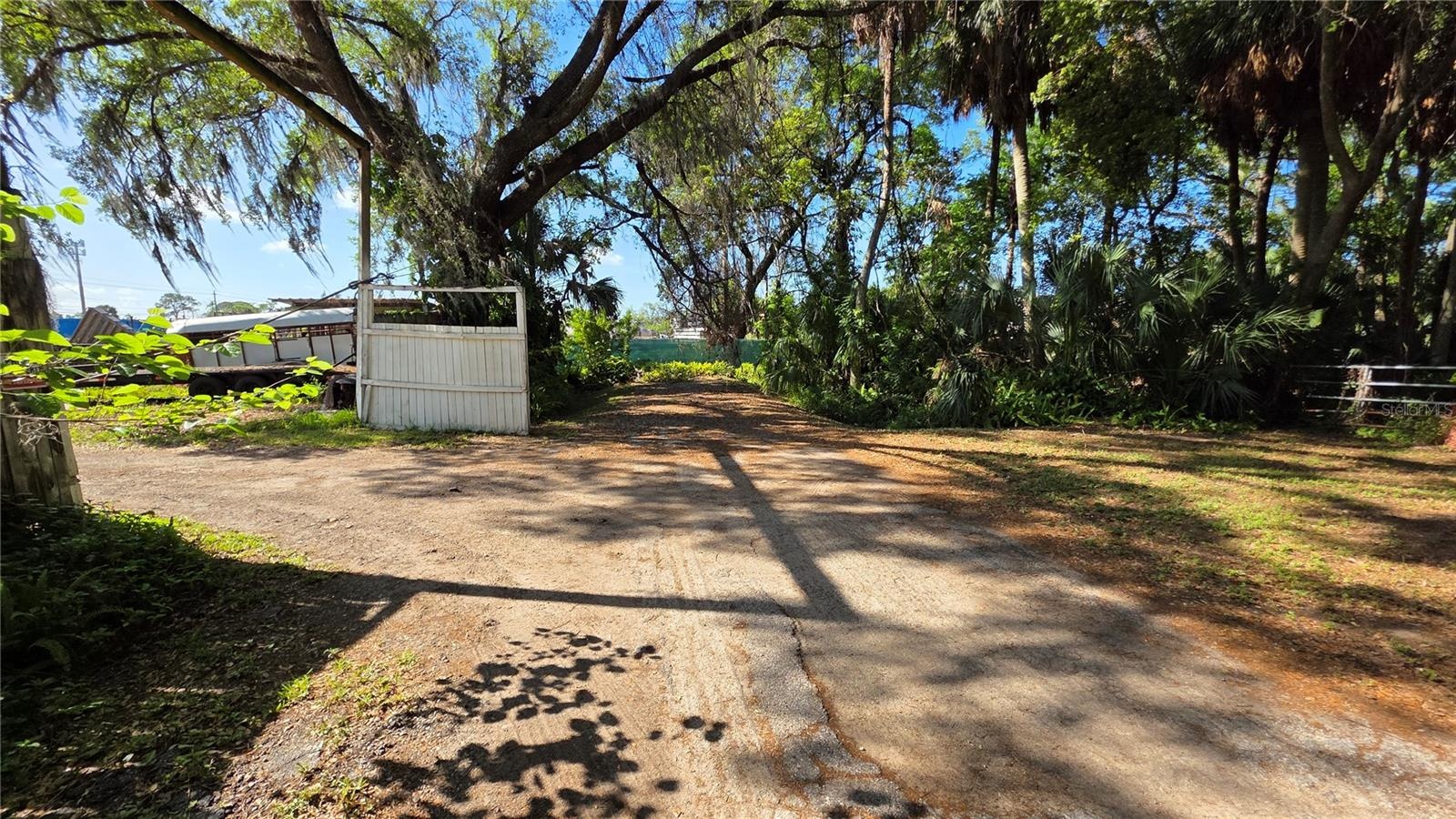 Back entrance into Lot A to the left.Also entrance into Lot B to the right.49th Street DEAD END is the Green Fence ahead.This is the back entrance to 