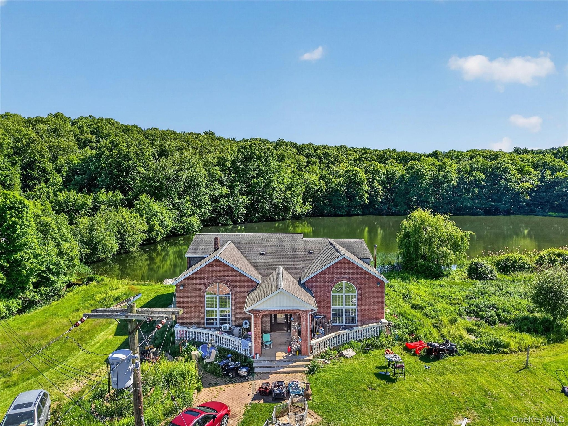 This lakefront home features 6 bedrooms, 4 bathrooms, and direct access to the private lake, complete with its own boat dock.