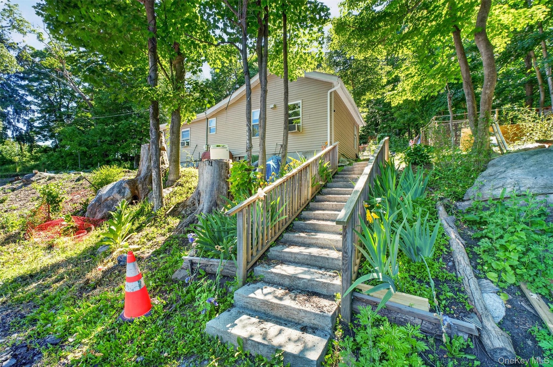 Stairs leading to a shared parking lot with 46 Bowen.