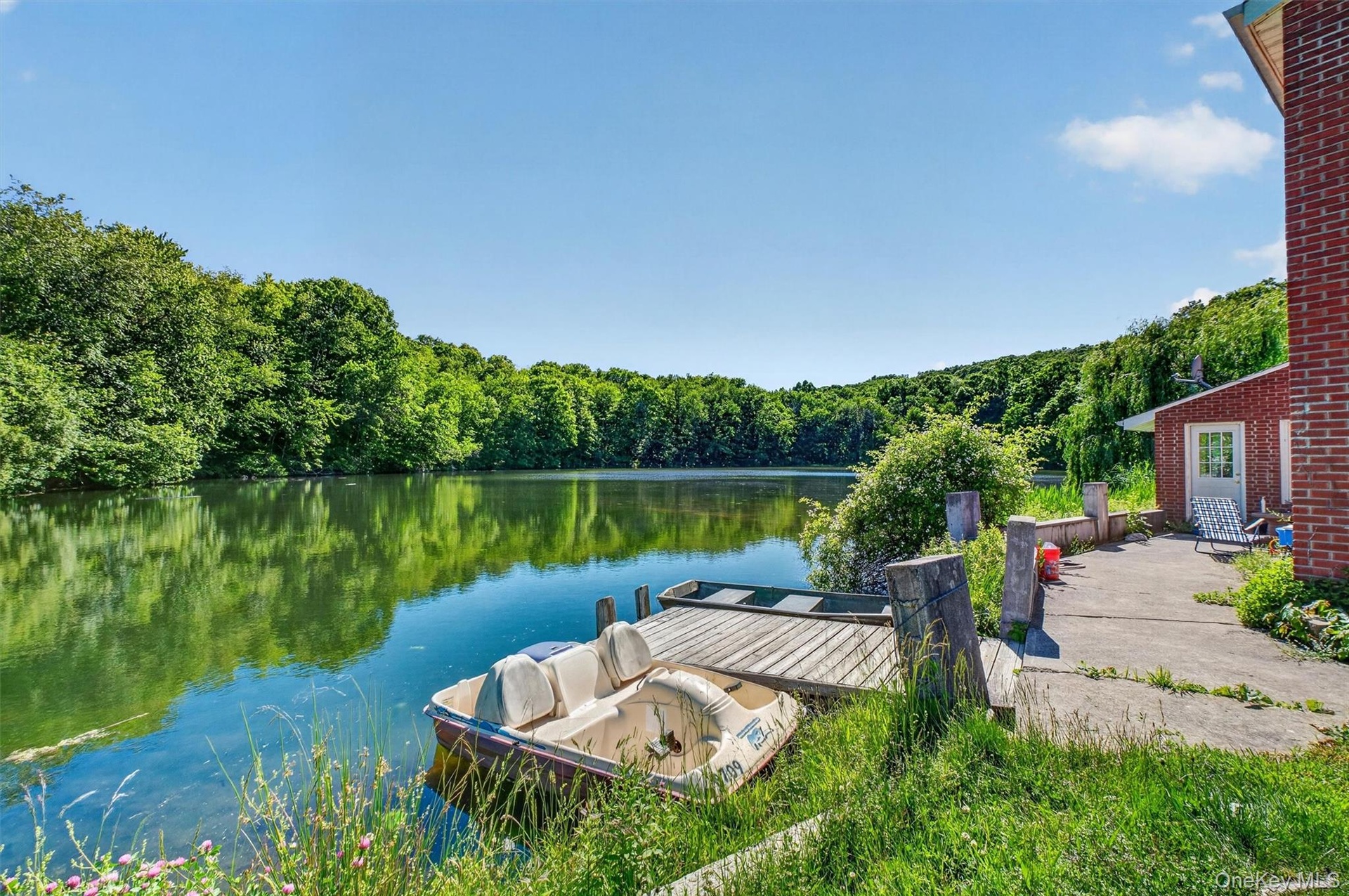 Enjoy picturesque lake views and direct water access from the home's convenient private dock.