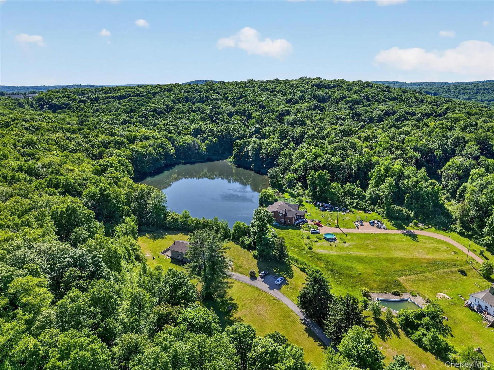 The developed portion of the two parcels includes a total of six single-family homes, offering flexibility for use as a private compound or an income-