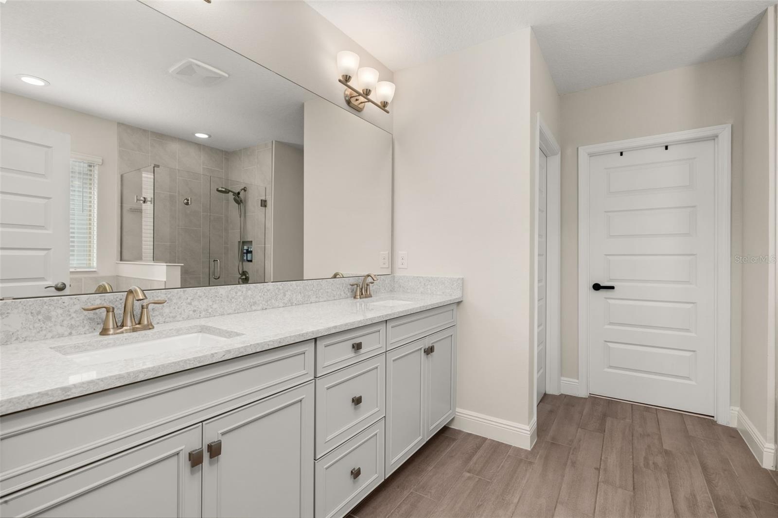 master bathroom with dual sinks