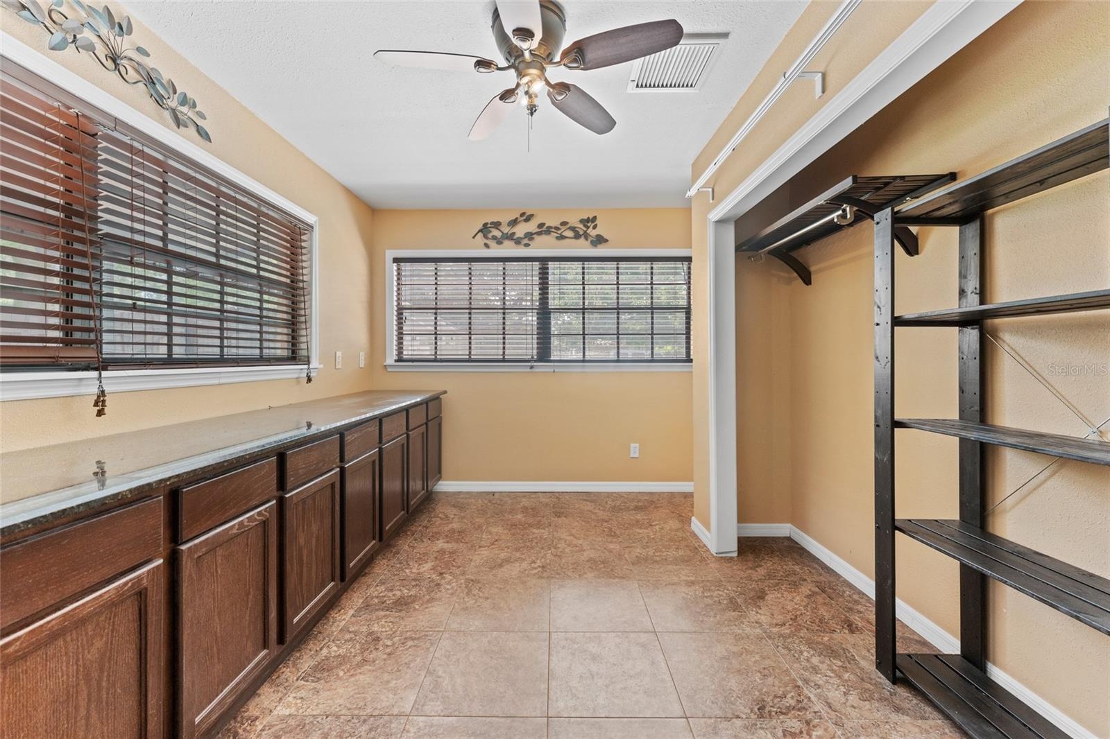 Office is 12' x 8', with ceramic tile, built-in cabinets, storage closet, and a ceiling fan.