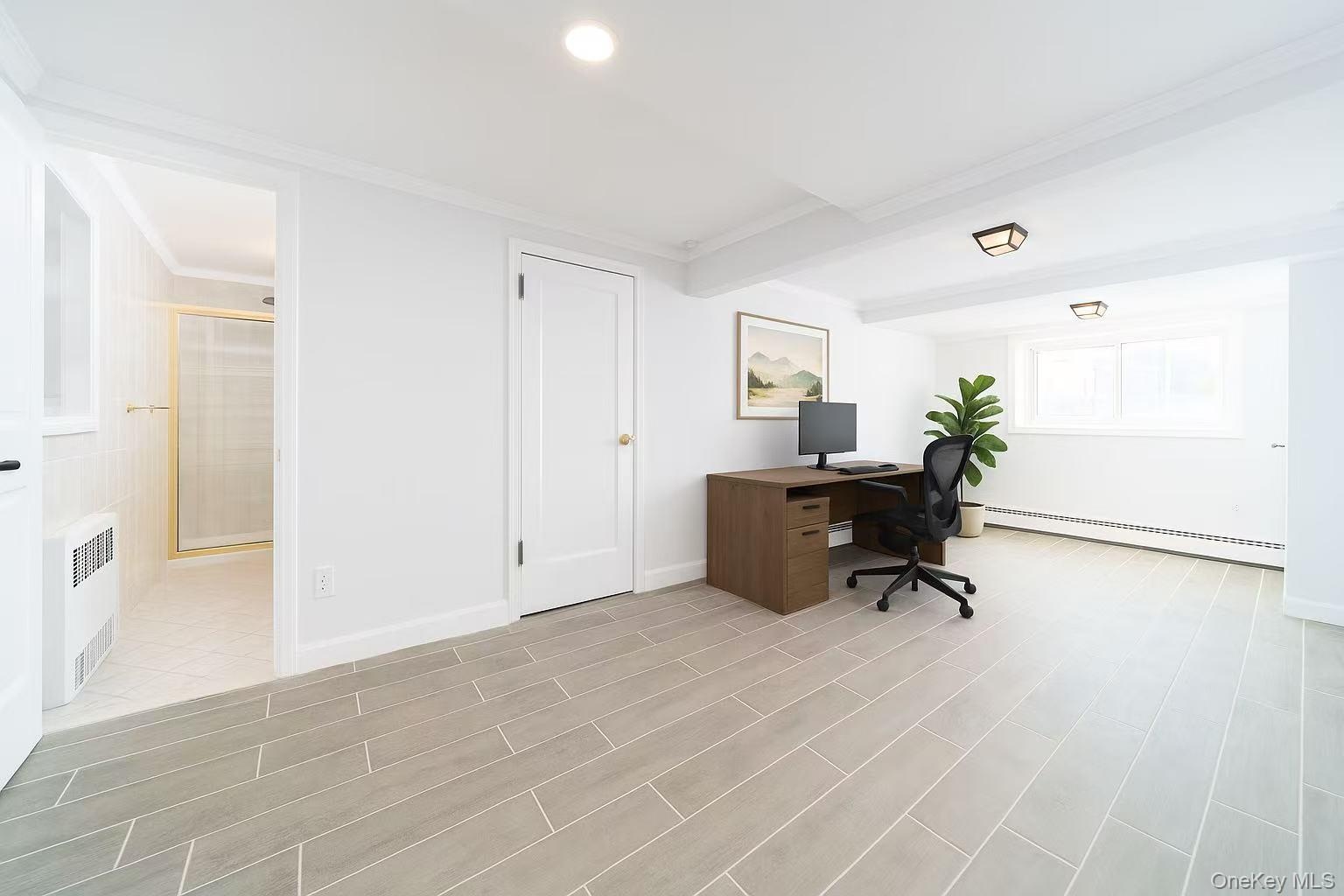 Office area with crown molding, a baseboard radiator, radiator heating unit, recessed lighting, and wood finish floors