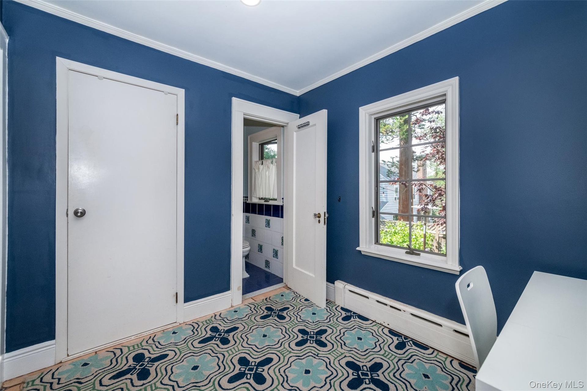 View of room featuring large pantry closet and powder room