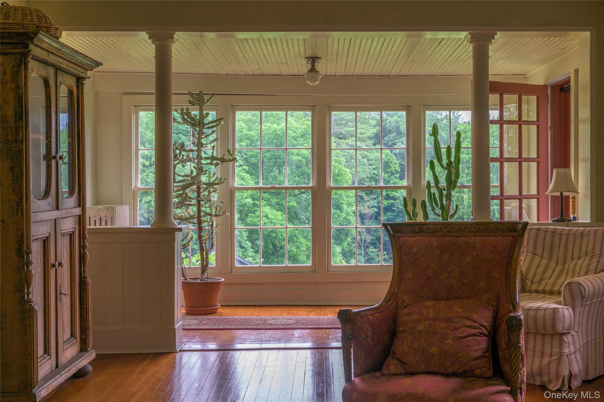 Sunroom with french doors and healthy amount of natural light