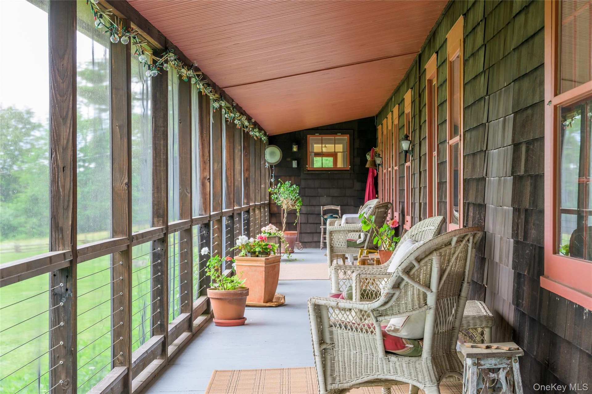 Sunroom featuring vaulted ceiling