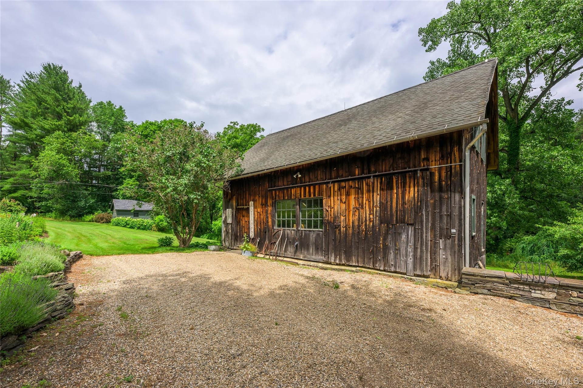 Garage featuring driveway