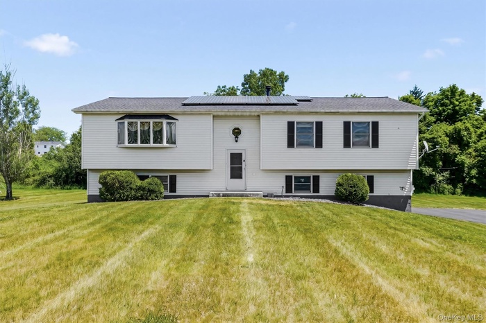 Spacious Raised Ranch set on level 1.21 acres