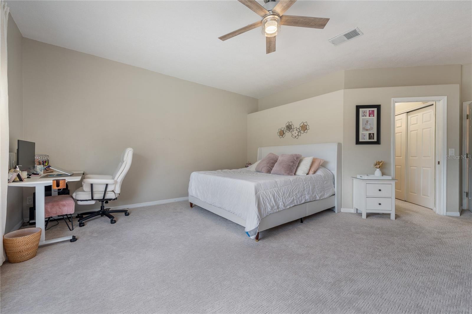 Oversized primary bedroom offering comfort, privacy, and generous square footage.