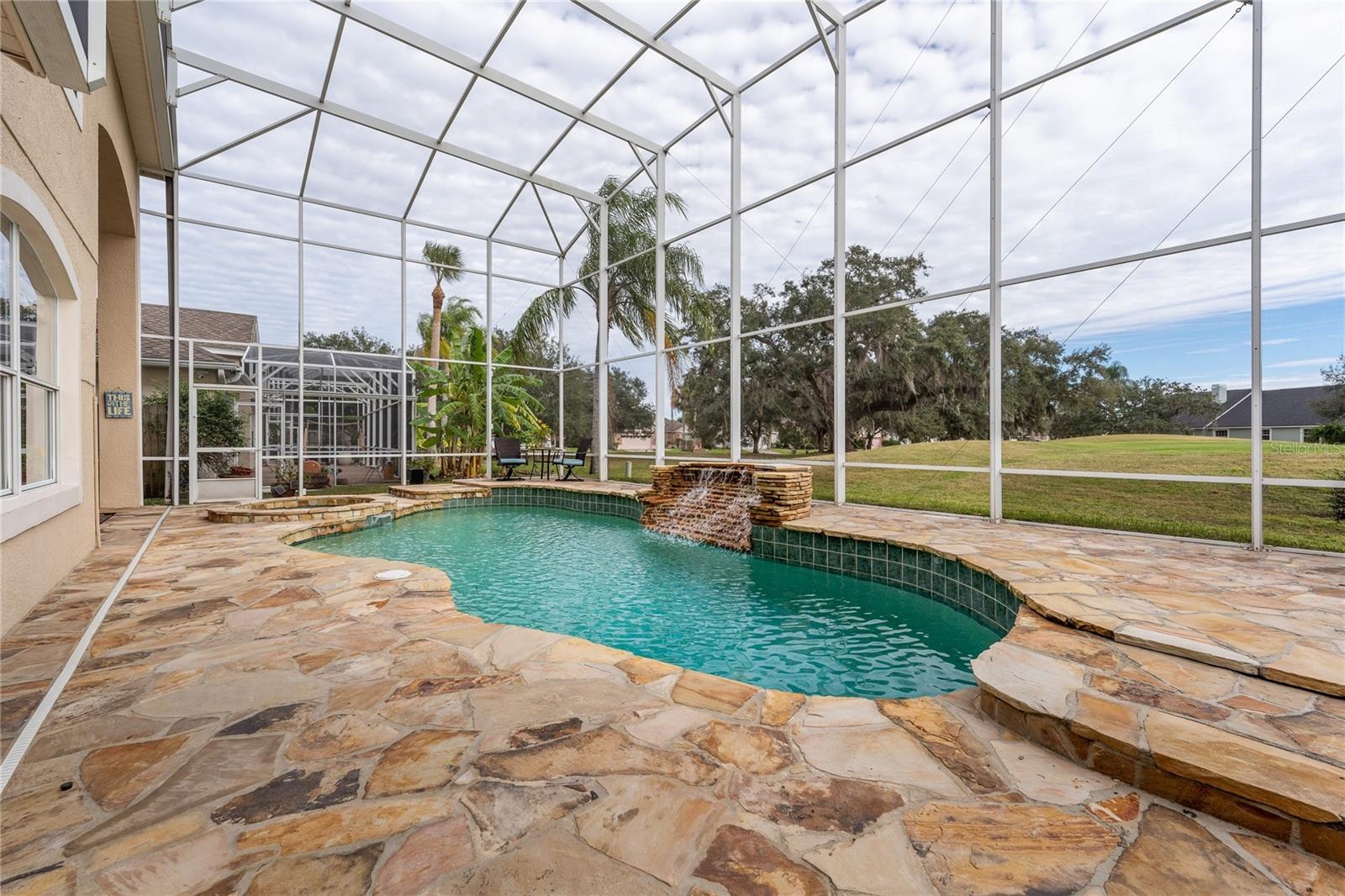 Resort-style heated pool and spa, fully screened for comfort and year-round enjoyment.