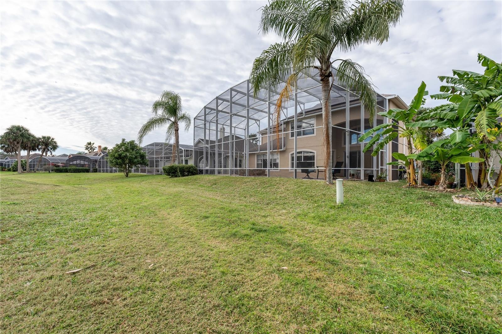 Golf-front backyard with open fairway views creating a park-like setting.