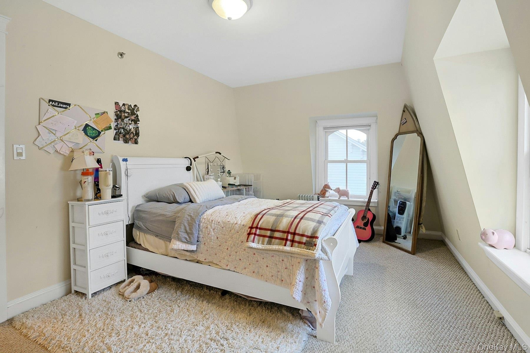 Bedroom with carpet flooring and baseboards