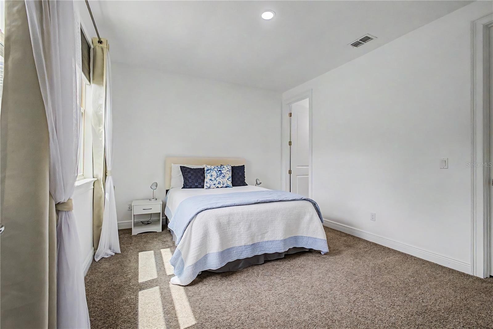 bedroom in-suite with walk-in closet