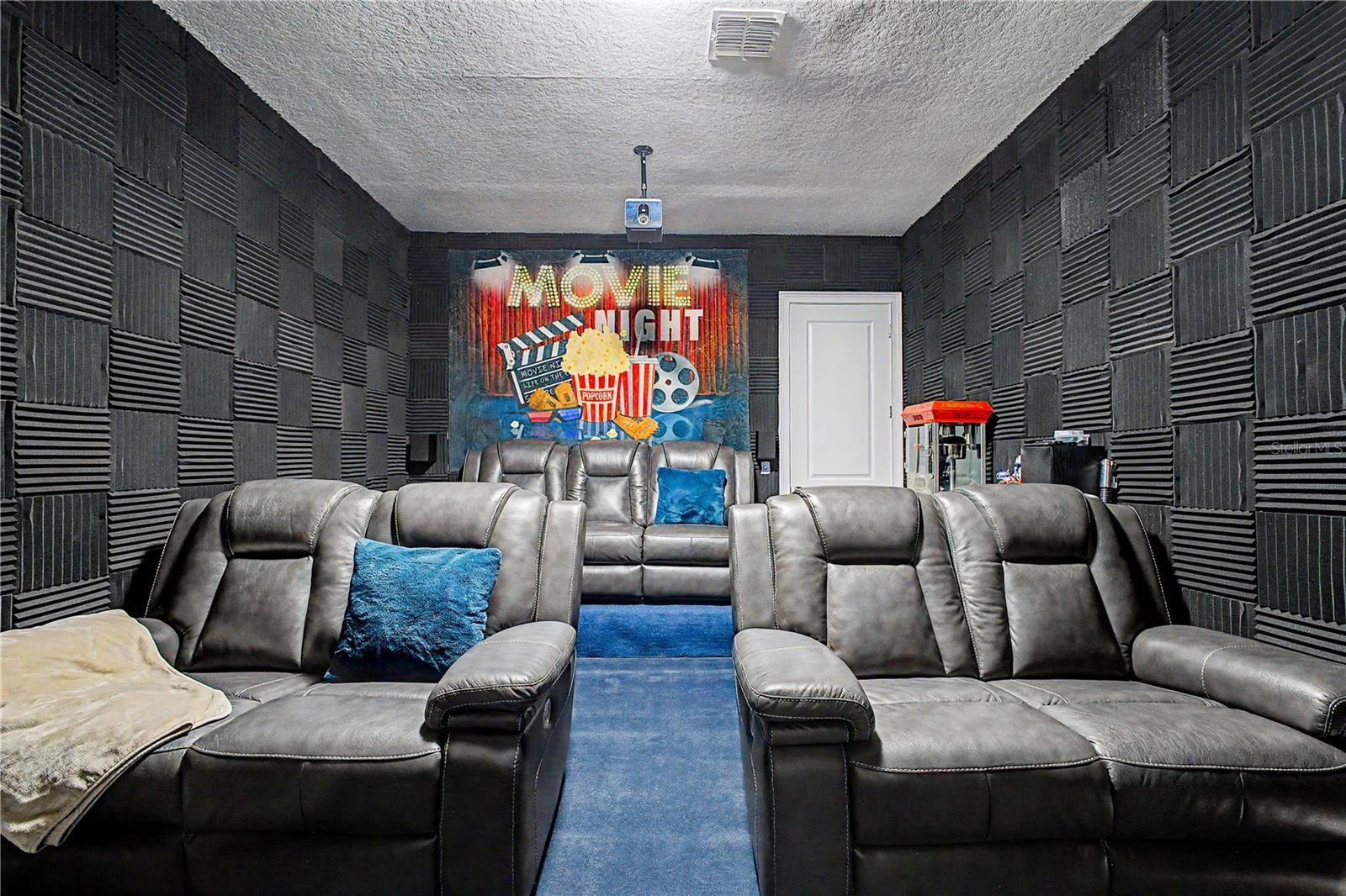 Bonus room setup as movie - could be turned into a 6th bedroom