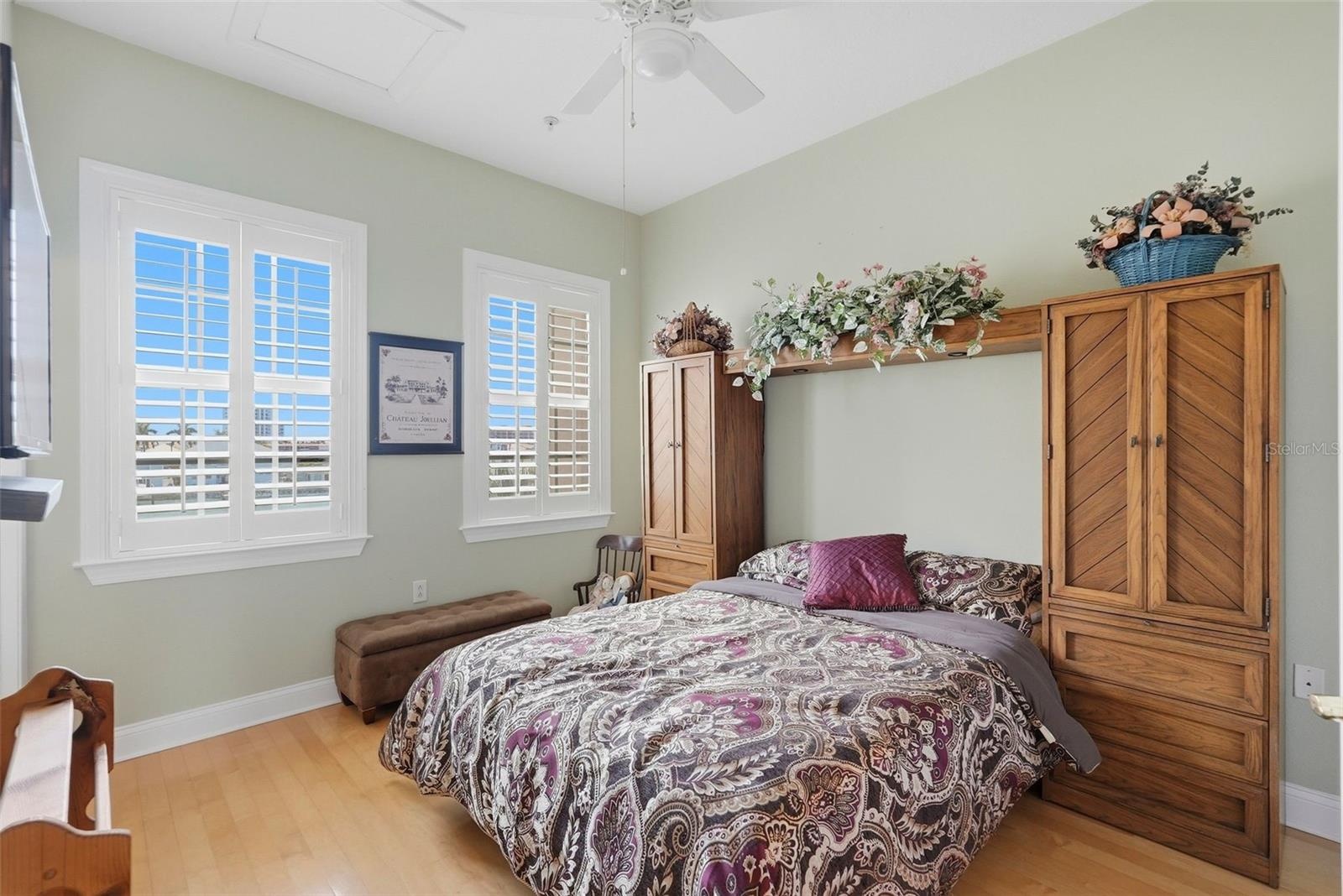 3rd level guest room with plantation shutters.