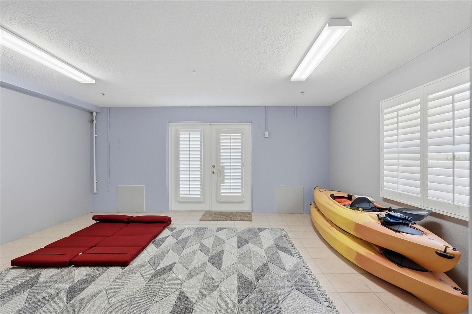 Climate-controlled bonus room on ground level leads to back patio!