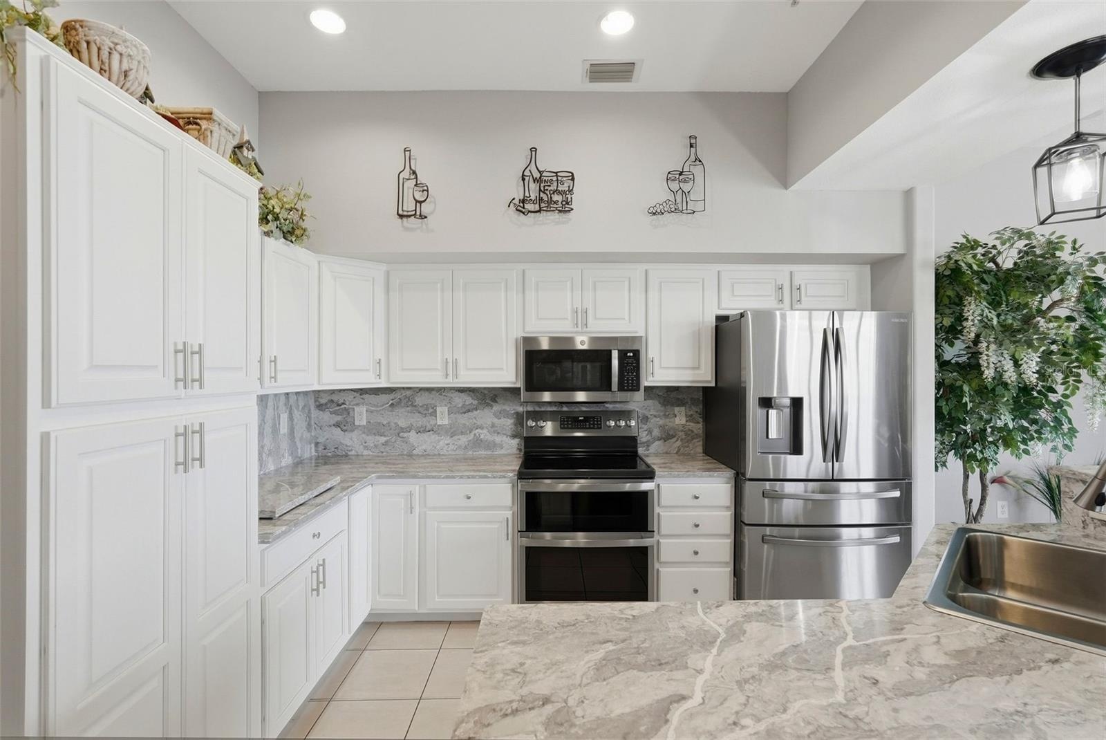 Kitchen with an oversized quartz island