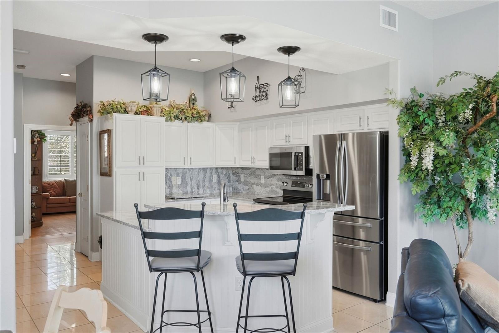 Walk past the kitchen to a spacious bedroom currently being used as an office.