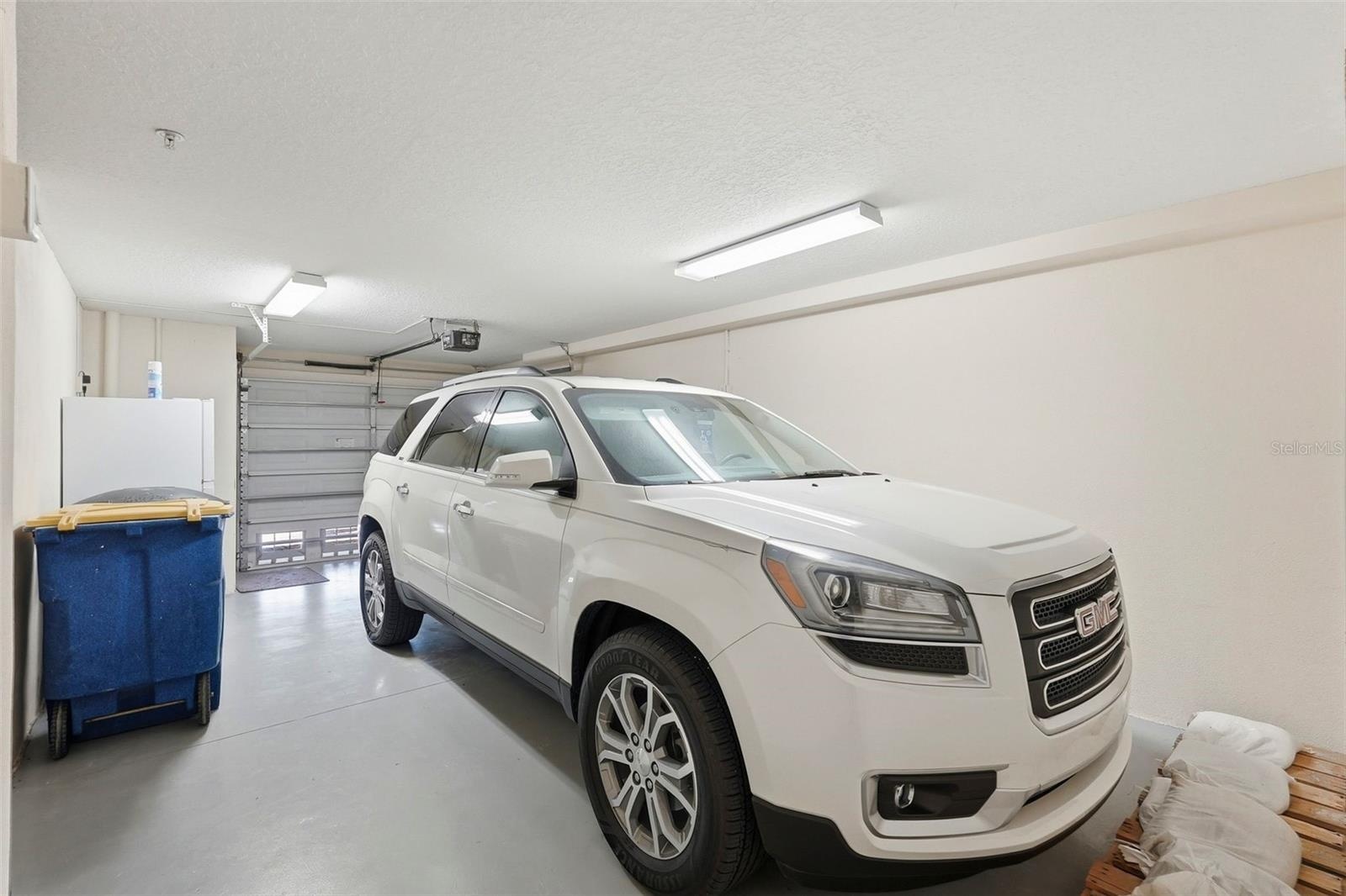 Spacious garage, currently one car as the current owners put up a partition wall for storage (next pic) which can easily be taken down to convert back