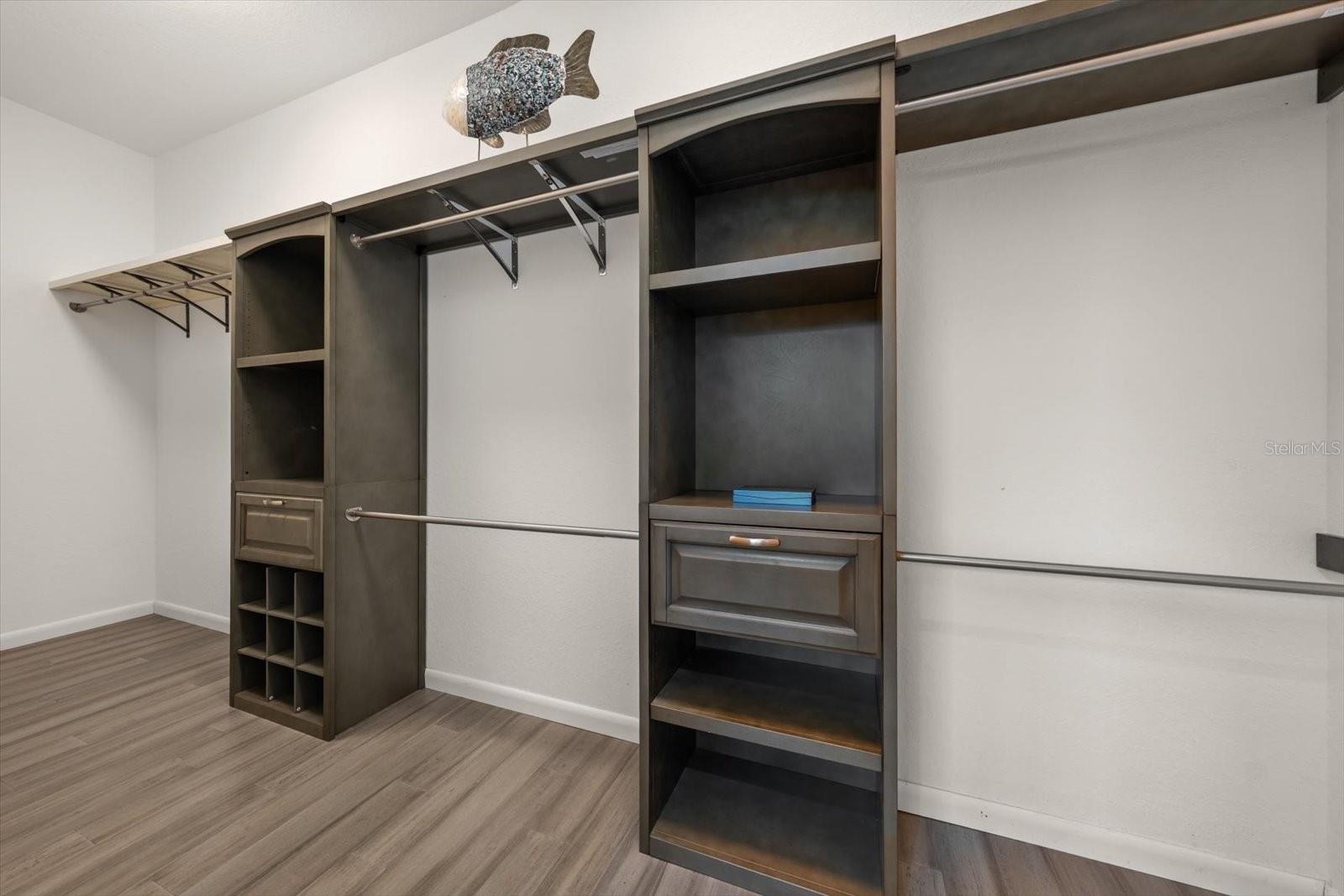 Large walk in customized closet in primary bedroom