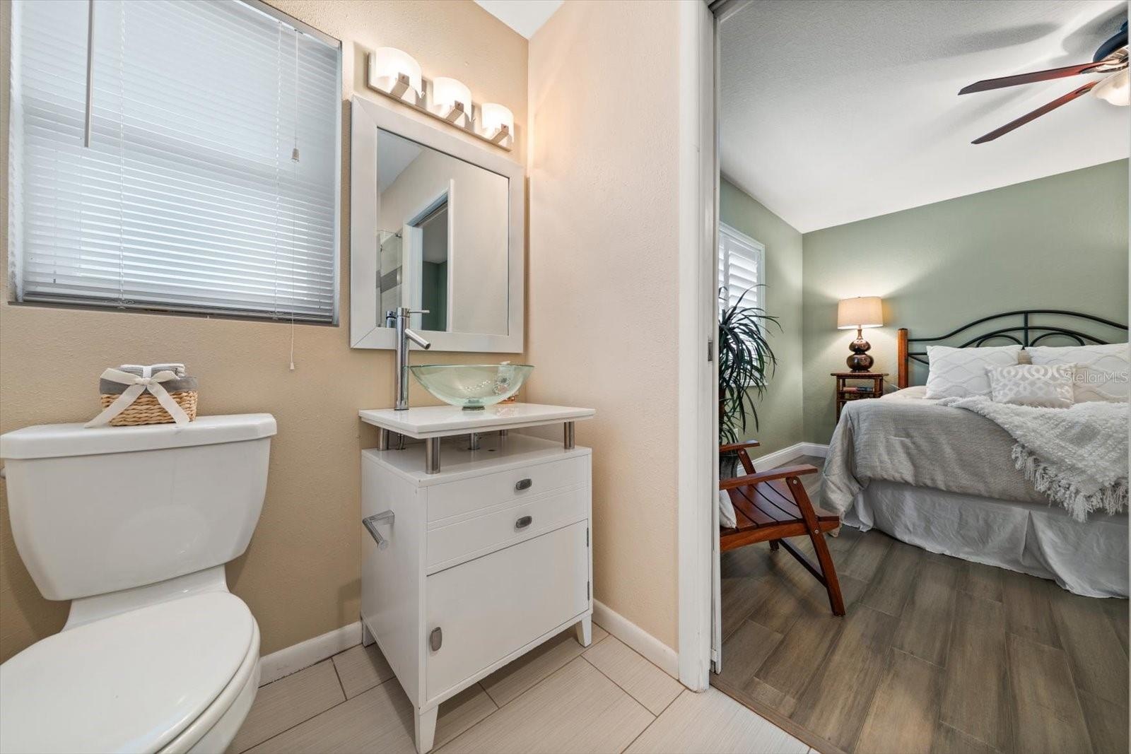 Attractive bath with walk in shower in second bedroom