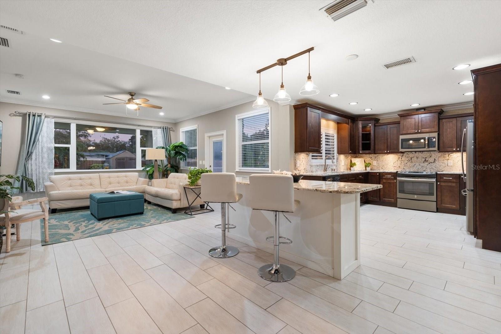 Family room flows seamlessly into a gourmet kitchen, perfect for everyday living and extertaining!