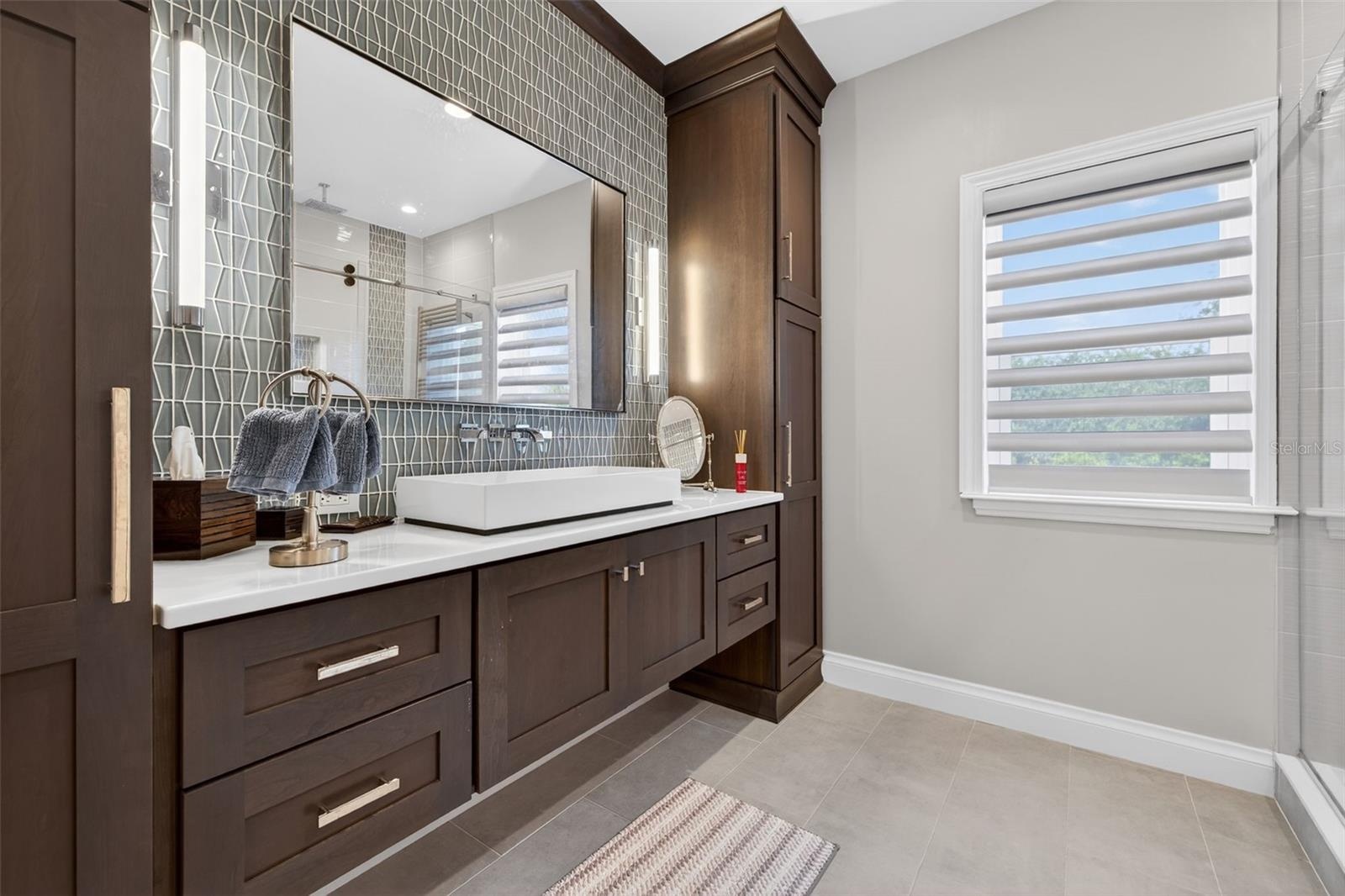 Bedroom 2 features a private ensuite bath with refined, modern finishes.
