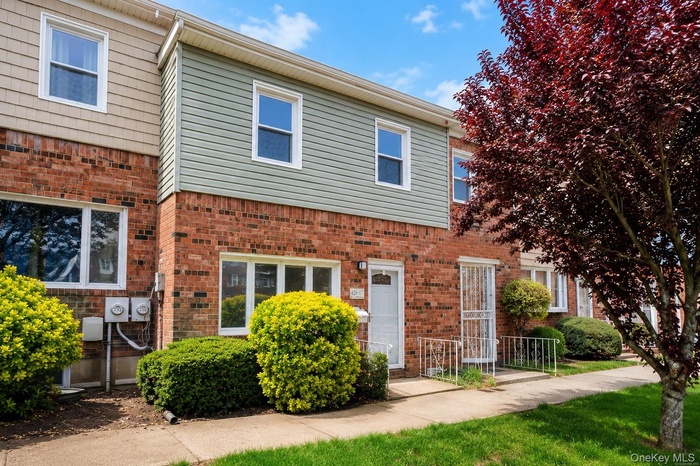 Brick and siding exterior with multiple windows