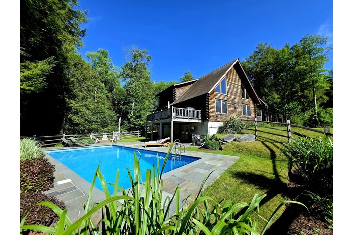 View of the back of the cabin & saltwater pool