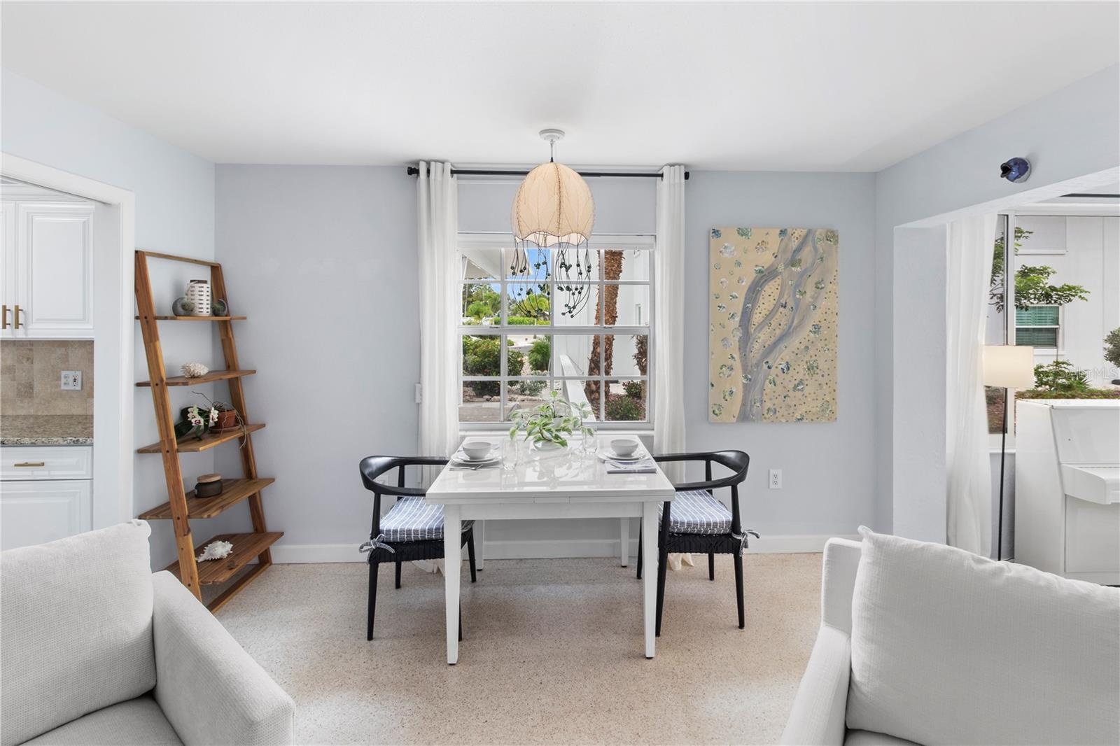 Dining Area with expandable Table to accommodate 6 - 8 people, with adorable jellyfish chandelier.