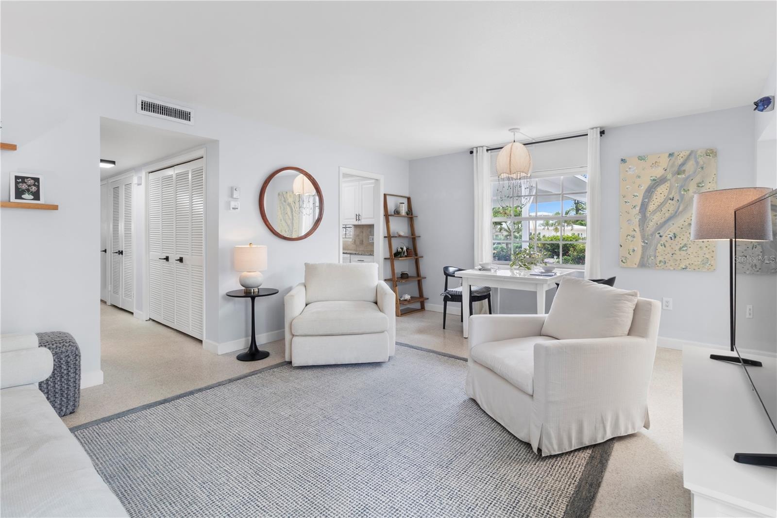 Living Room view from front door with Swivel Chairs