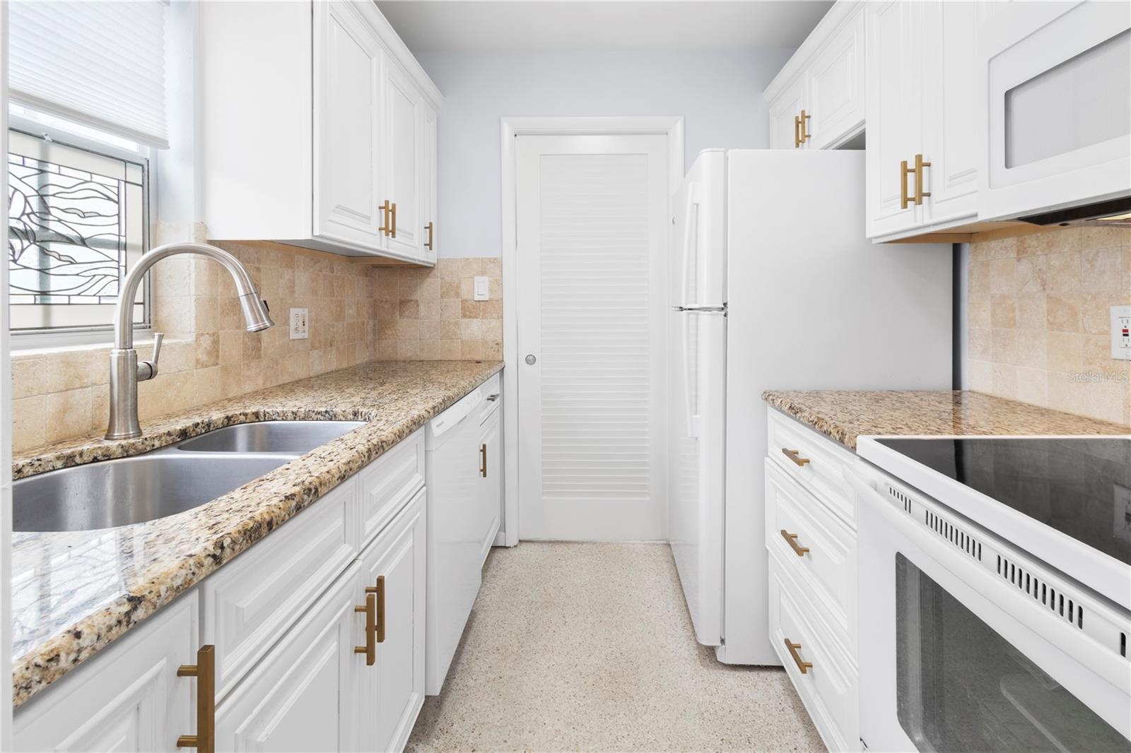 Kitchen view towards dining room - showing door closed for privacy