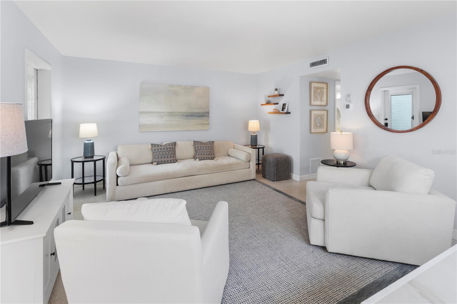 Living Room view from dining area with Large couch (could substitute for sleeper sofa)