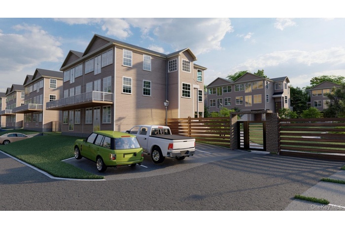 Multi-story residential buildings featuring siding exteriors and multiple balconies