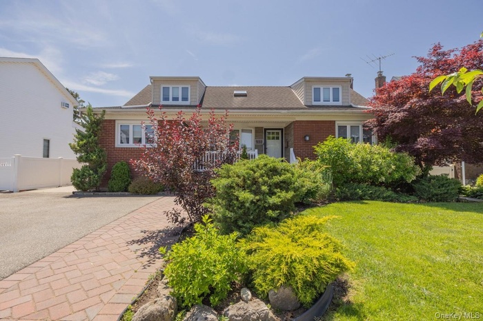 Brick front, New vinyl siding dormers