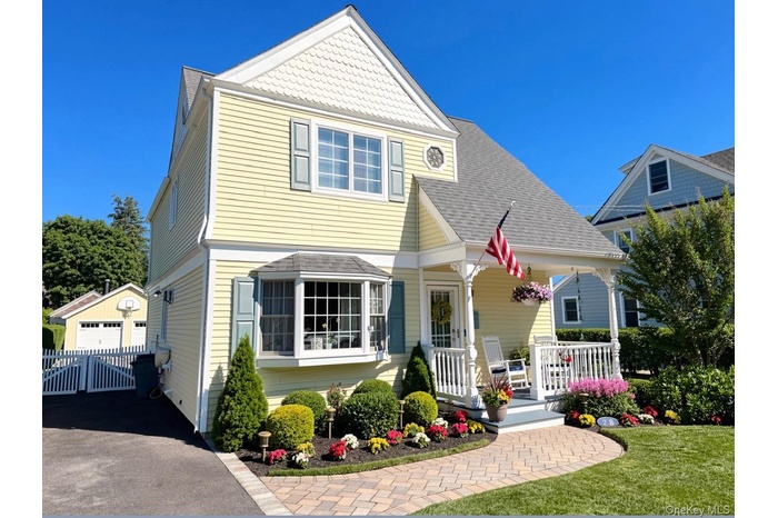 AI generated blue sky. Yellow siding exterior with white trim and a covered front porch