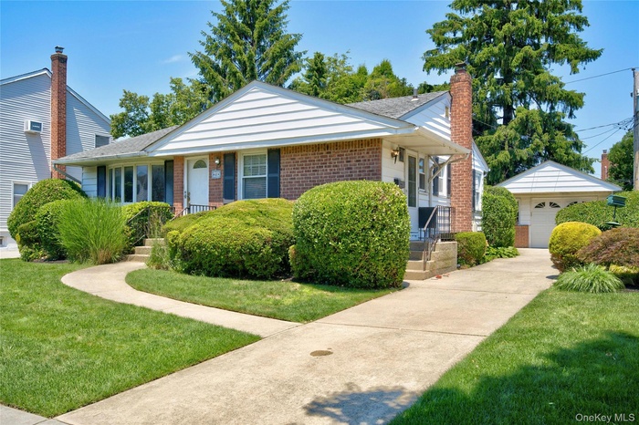Front of house showing detached garage