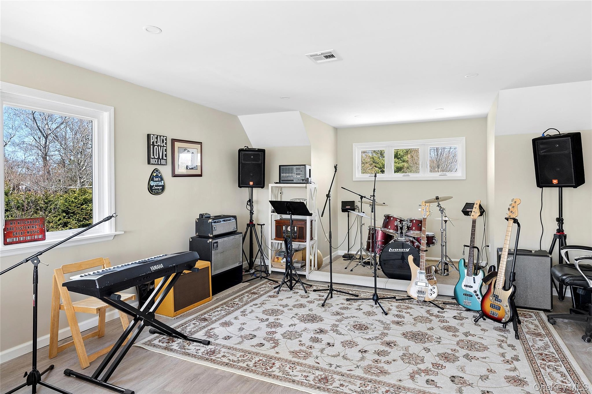 Rec room with light wood-style flooring
